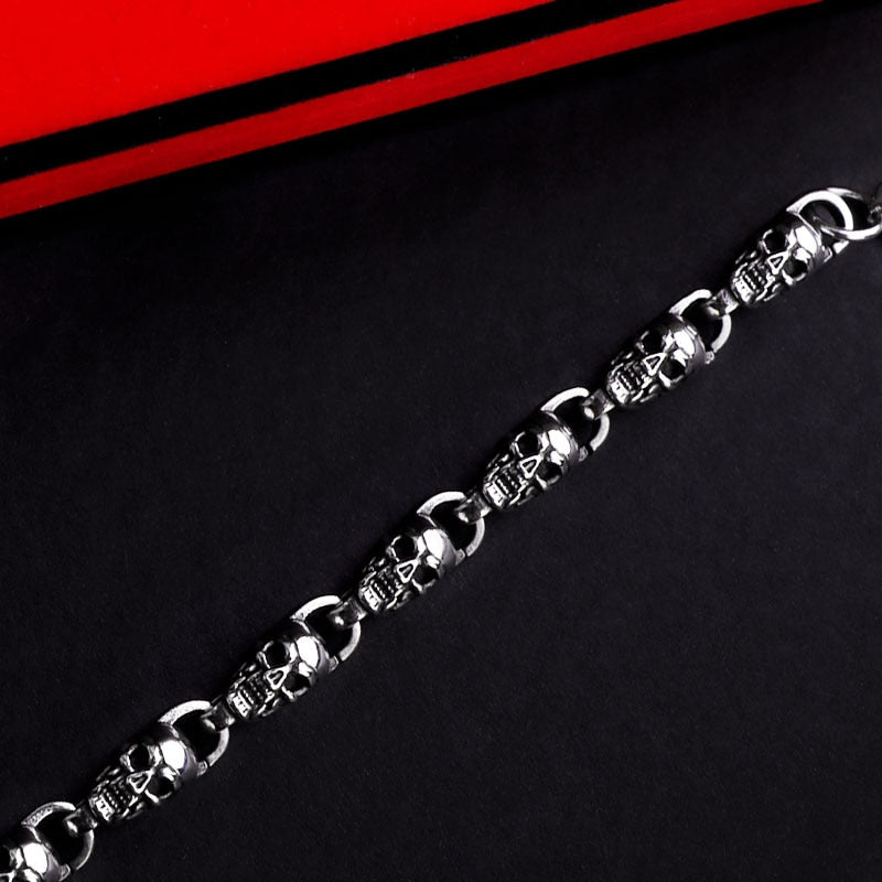 Reworking the title to emphasize the product's essence while maintaining its distinctiveness from the original. Any references to '""' or similar labels should be eliminated. 
Skull-Adorned Gothic Chain Bracelet