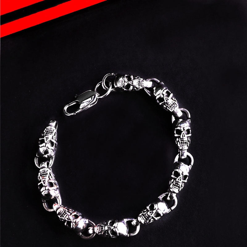 Reworking the title to emphasize the product's essence while maintaining its distinctiveness from the original. Any references to '""' or similar labels should be eliminated. 

Skull-Adorned Gothic Chain Bracelet