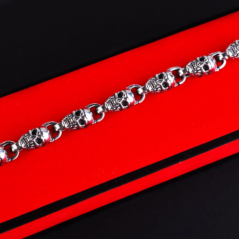Reworking the title to emphasize the product's essence while maintaining its distinctiveness from the original. Any references to '""' or similar labels should be eliminated. 

Skull-Adorned Gothic Chain Bracelet