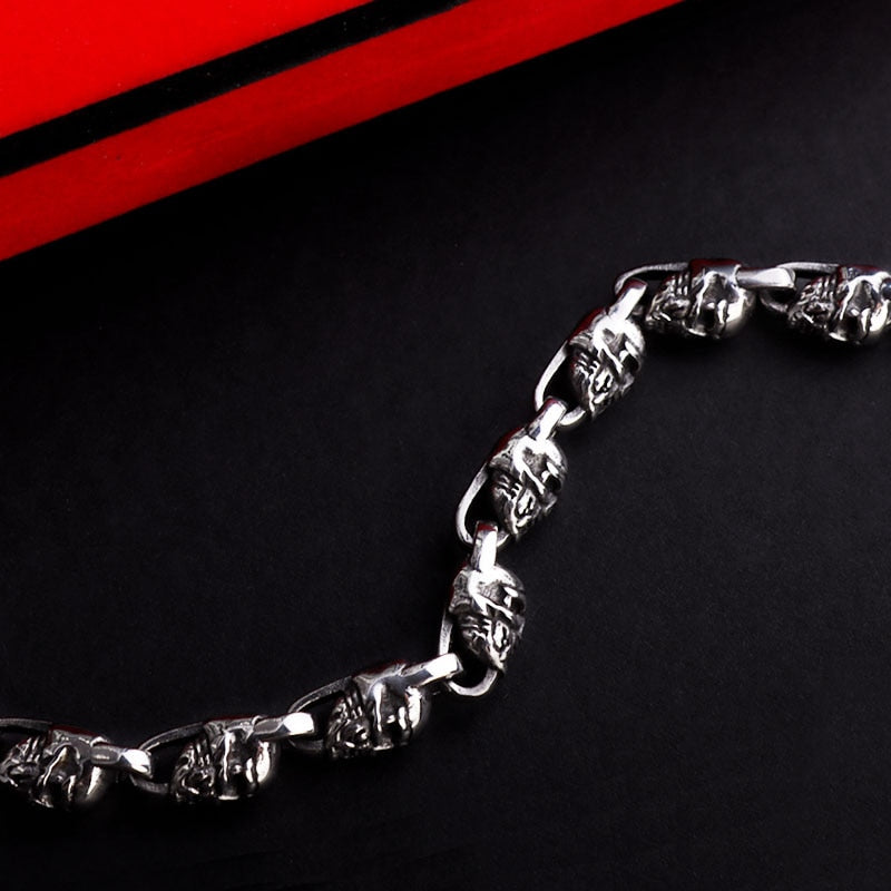 Reworking the title to emphasize the product's essence while maintaining its distinctiveness from the original. Any references to '""' or similar labels should be eliminated. 

Skull-Adorned Gothic Chain Bracelet